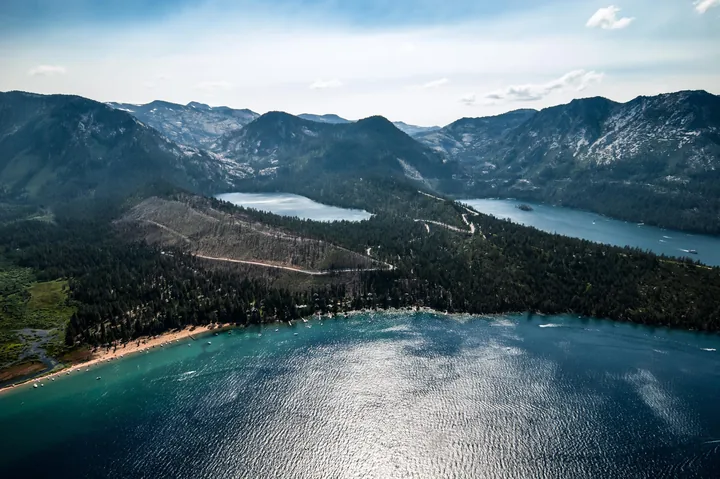 Aerial view over Lake Tahoe and the mountains from a helicopter