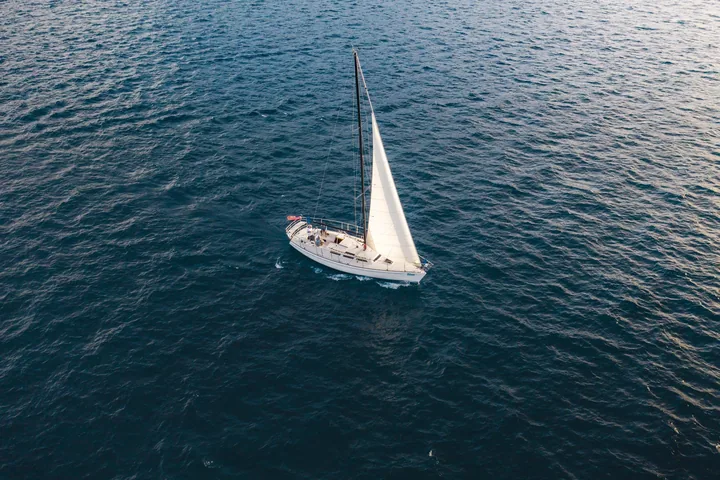 A white sailboat on deep blue Lake Tahoe
